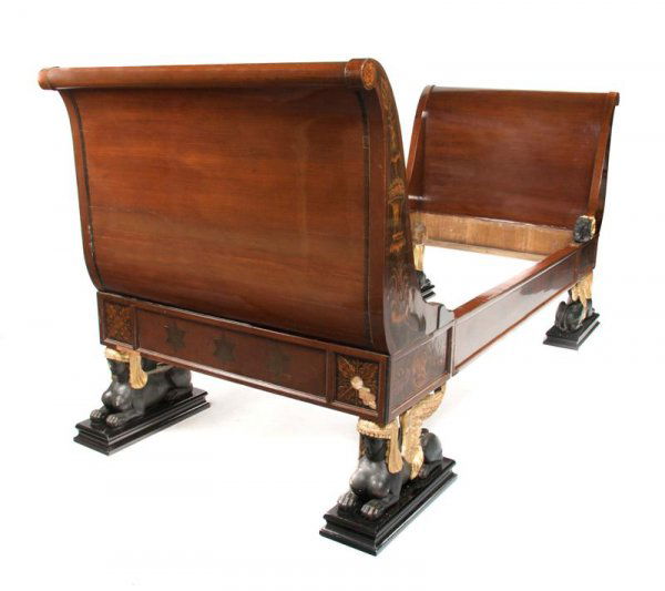 A Pair of Continental Mahogany Pen Work, Marquetry: A Pair of Continental Mahogany Pen Work, Marquetry, Ebonized and Parcel Gilt Daybeds, the outswept ends with foliate putto inlay raised on sphinx supports. Height 43 x width 97 3/4 x depth 40 inches.