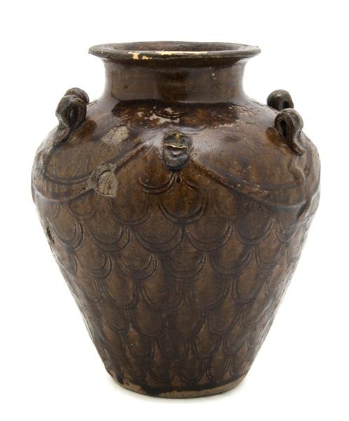 A Southeast Asian Brown Glazed Dragon Vase, Heigh: A Southeast Asian Brown Glazed Dragon Vase, of typical baluster form in the style of the 10th/11th century. Height 8 1/2 inches.