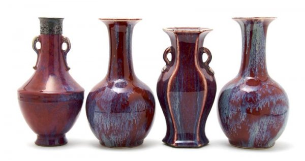 A Group of Four Oxblood Glazed Vases, Height of t: A Group of Four Oxblood Glazed Vases, each of baluster form, comprised of one pair, a silver mounted example and another. Height of tallest 9 inches. Property from the Estate of Mr. Melvin Bullard, Ch