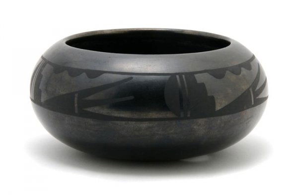 A San Ildefonso Blackware Bowl, Maria and Santana: A San Ildefonso Blackware Bowl, Maria and Santana Martinez, having stylized geometric design throughout, signed Maria and Santana. Diameter 7 inches.