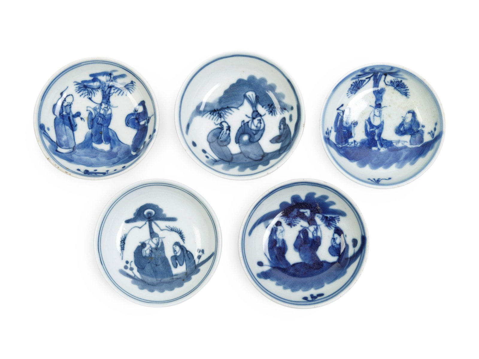 Five Chinese Blue and White Porcelain Wine Cups: Five Chinese Blue and White Porcelain Wine Cups each of circular form, painted with scholars under pine trees, together with a fitted box and original receipt. Diameter of each 3 1/8 in., 8.2 cm. Prop