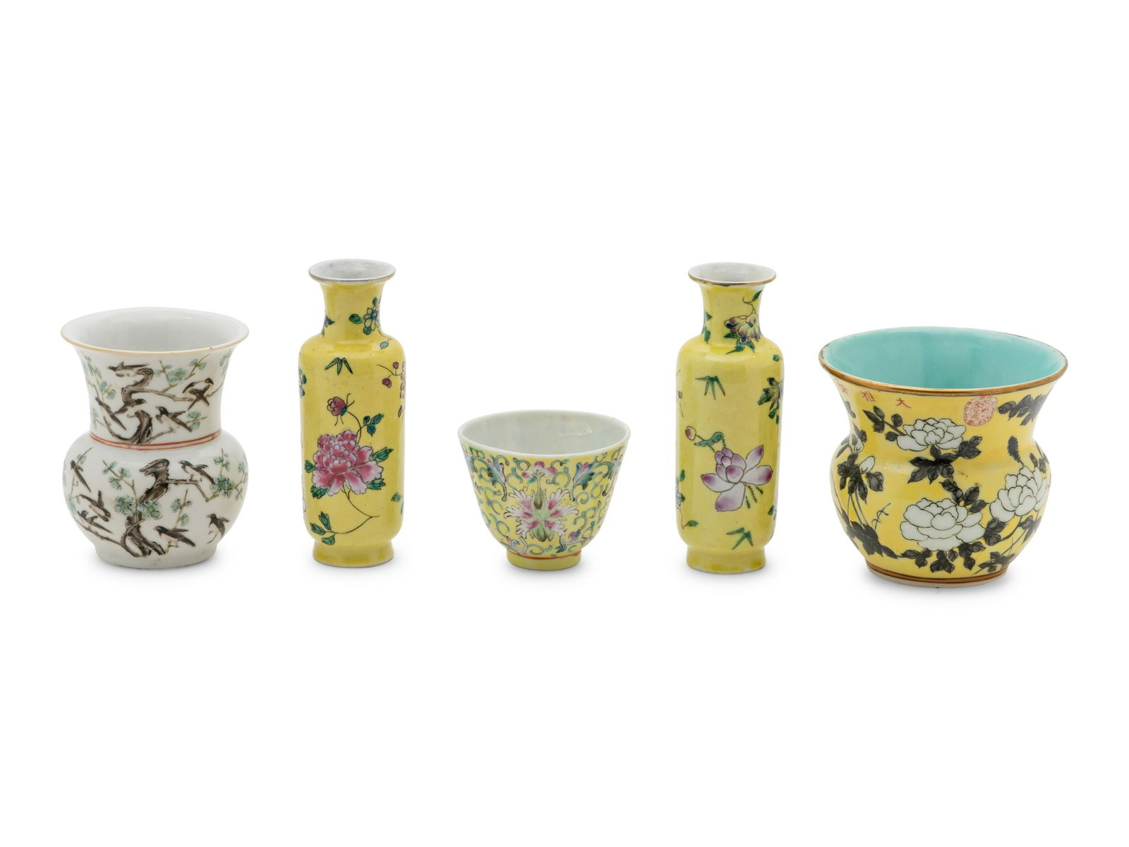 Five Chinese Famille Rose Porcelain Wares: Five Chinese Famille Rose Porcelain Wares 20TH CENTURY comprising a pair of yellow ground vases, a yellow ground wine cup, a yellow ground spittoon, and a white ground spittoon, each decorated with fl