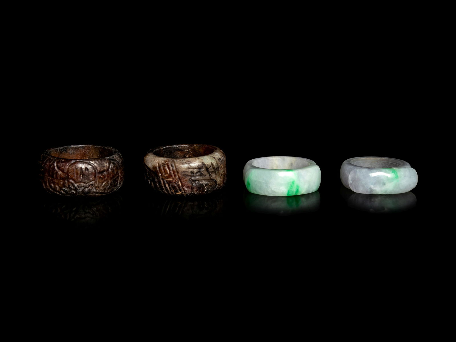 Two Chinese Jadeite Archer's Rings and A Pair of (1 of 2)