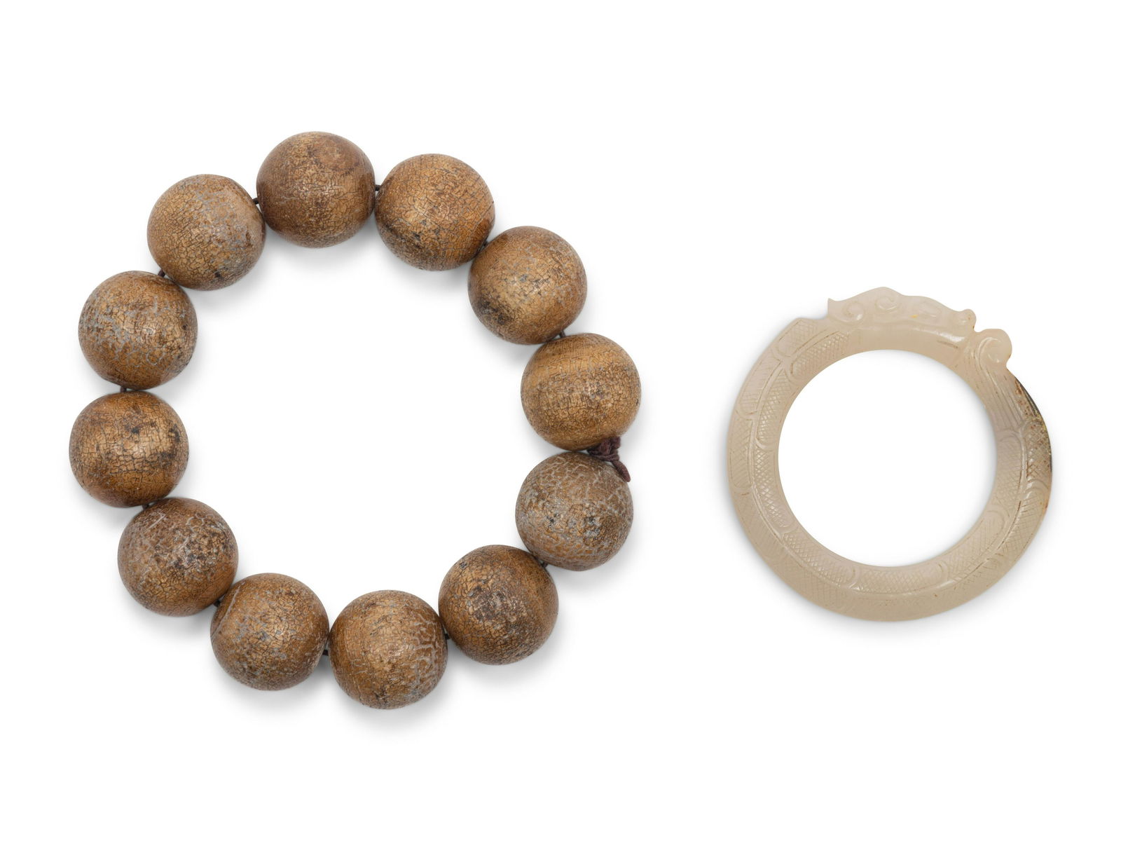 A Chinese Jade 'Dragon' Pendant and a Strand of Wood (1 of 3)