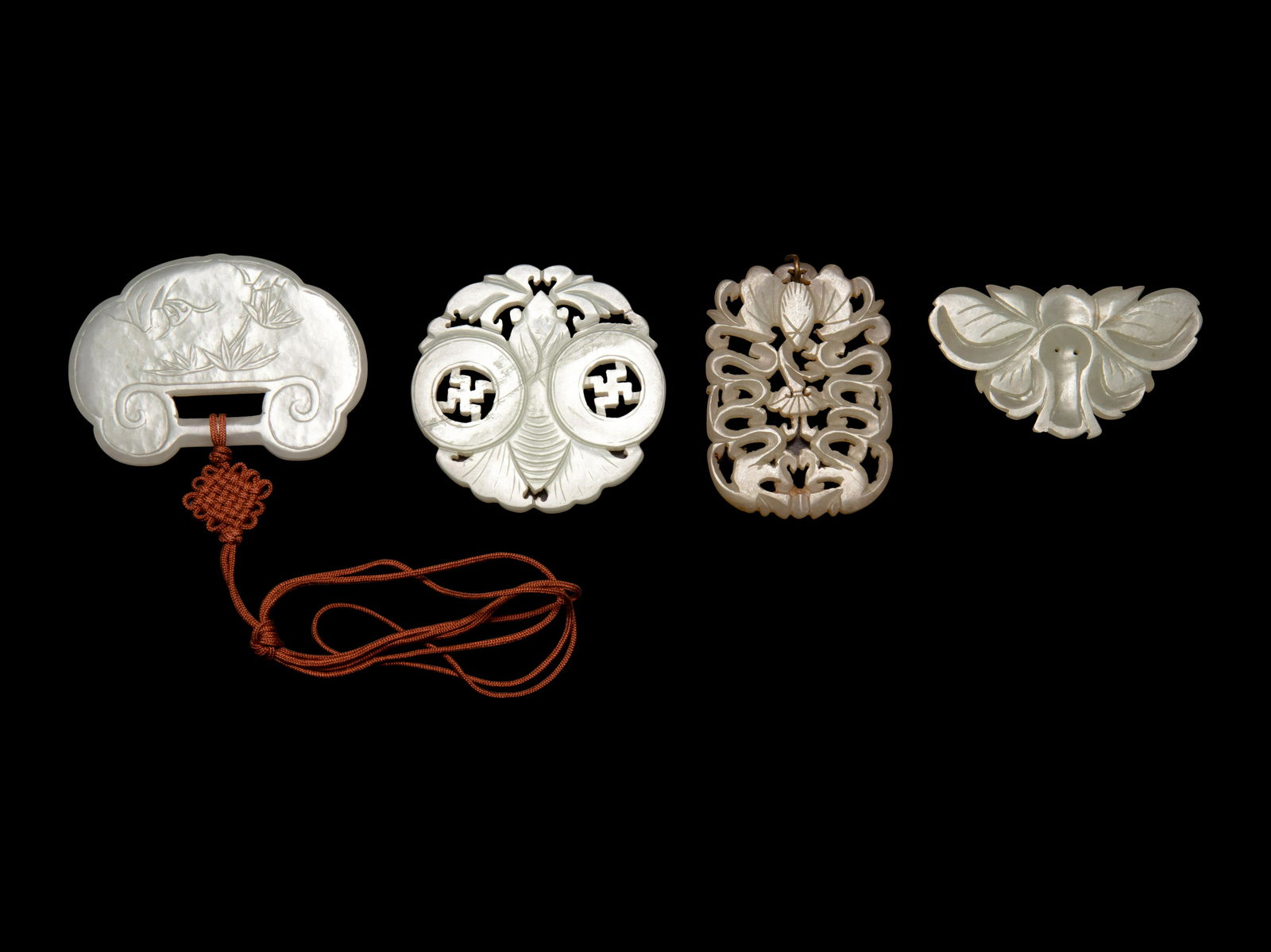 Four Chinese Pale Celadon Jade Pendants (1 of 2)