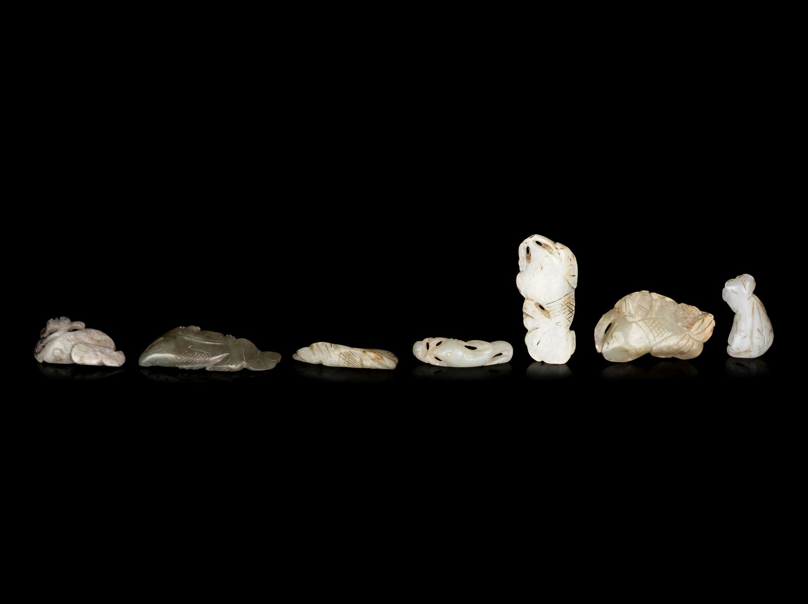 Seven Chinese Celadon Jade Carvings of Fish (1 of 2)