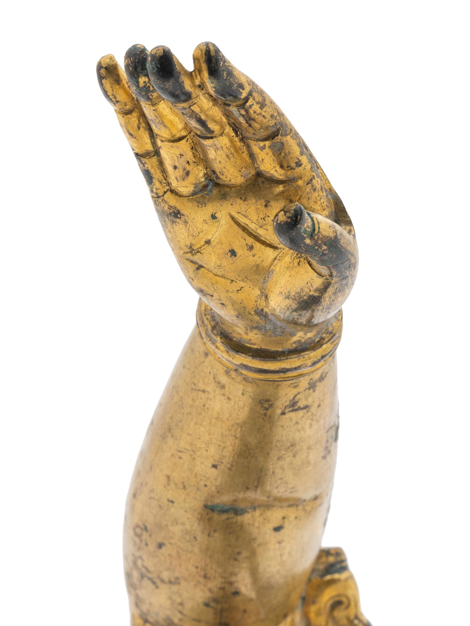 A Chinese Gilt Bronze Buddha Arm: A Chinese Gilt Bronze Buddha Arm bent at the elbow, the fingers gracefully extended, the nails and knuckles naturalistically rendered. Length 8 in., 20.3 cm.