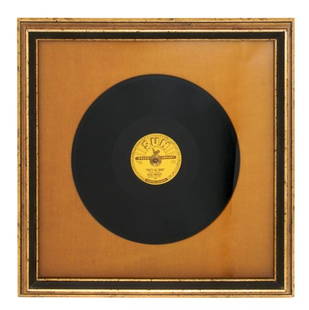 An Original 1954 Elvis Presley Sun Records That's Al: An Original 1954 Elvis Presley Sun Records "That's All Right" 78rpm Album, framed and mounted with a descriptive plaque. Recorded July 1954, when the singer was 19 years old, "That's All Right" and