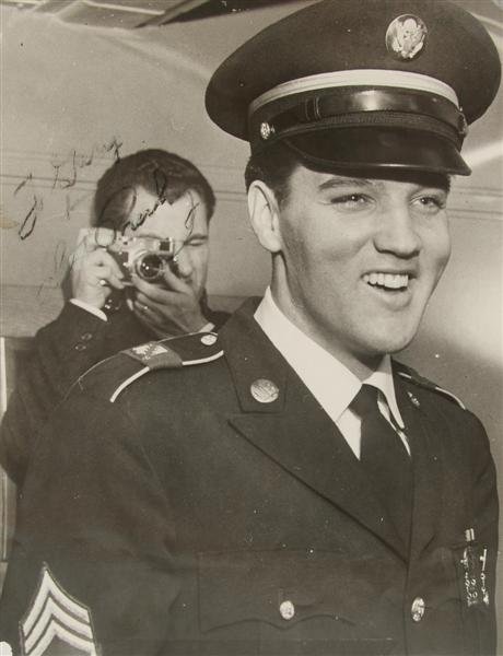 A Photograph of Elvis Presley in Uniform Signed Twi: A Photograph of Elvis Presley in Uniform Signed Twice, black and white, 8 x 10 inches, signed and inscribed to the front, "To Gary from Elvis Presley," in black ink, and to the back, "To Gary, many th