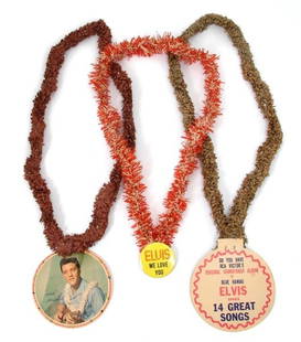 A Group of Seven Blue Hawaii Promotional Leis,: A Group of Seven Blue Hawaii Promotional Leis, three with original cardboard buttons, together with a photograph of Gary and the Tankers outside the premier for Blue Hawaii wearing the novelty leis,