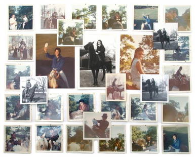 A Group of Original Photographs and Negatives of E: A Group of Original Photographs and Negatives of Elvis and Priscilla on Horseback, comprising 31 original photographs and ten negatives of the couple riding Domino and Rising Sun and signing