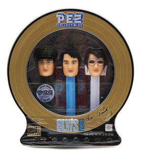 A Pez Collectibles Elvis Presley Gift Tin,: A Pez Collectibles Elvis Presley Gift Tin, with three dispensers, three Pez candy cartridges, and a three-track Elvis Presley CD included.