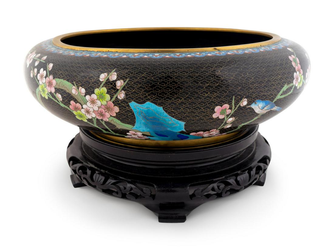 A Chinese Cloisonné Circular Bowl: A Chinese Cloisonné Circular Bowl Raised on a conforming stand. Height 5 x diameter 15 inches; height of stand 3 1/2 inches. Property from the Michael Hall Collection, Miami Beach, Florida Note: