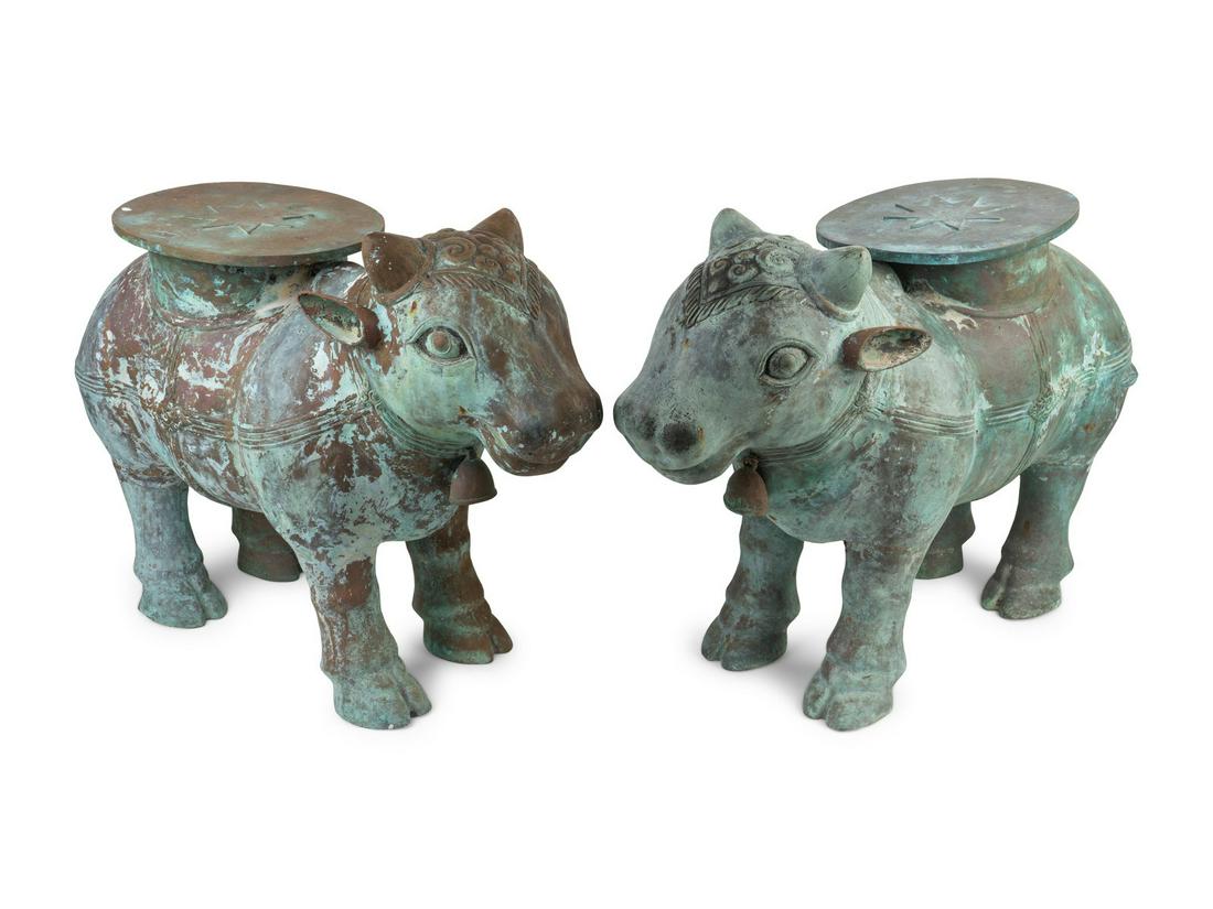 A Pair of Indian Sacred Cow-Form Metal Garden Seats: A Pair of Indian Sacred Cow-Form Metal Garden Seats Height 19 x length 26 x width 10 inches. Property from the Michael Hall Collection, Miami Beach, Florida Note: By all accounts, Michael Hall, actor,