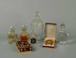 A Group of Seven French Glass Bottles For Guerlain: A Group of Seven French Glass Bottles For Guerlain, including two marked Baccarat and two with original boxes. Height of tallest 9 inches.