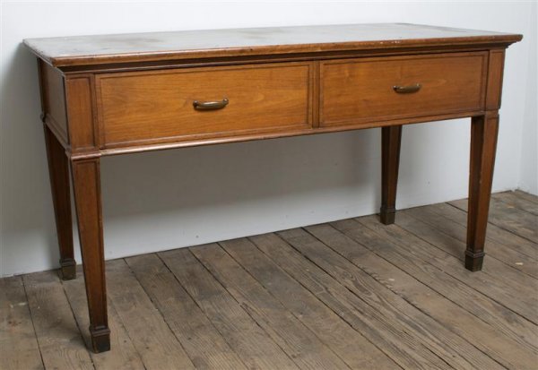 An English Mahogany Bureau, Height 34 x width 60 x : An English Mahogany Bureau, the rectangular top over two drawers raised on square tapering legs. Height 34 x width 60 x depth 28 inches. Property from the Estate of Mr. Gerald Arpino, Chicago, Illinoi