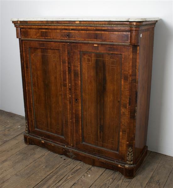 A Mahogany Veneer Side Cabinet, Height 52 inches.: A Mahogany Veneer Side Cabinet, having a marble top. Height 52 inches. Property from the Estate of Mr. Gerald Arpino, Chicago, Illinois