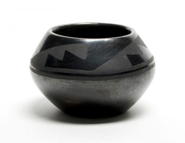 A San Ildefonso Blackware Pottery Bowl, Diameter 5: A San Ildefonso Blackware Pottery Bowl, having allover stylized geometric decoration, signed Desideria. Diameter 5 inches.