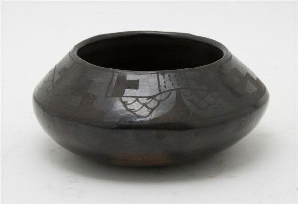 A San Ildefonso Blackware Bowl, Diameter 8 inches.: A San Ildefonso Blackware Bowl, of low, circular form, decorated with a stylized geometric band. Diameter 8 inches.