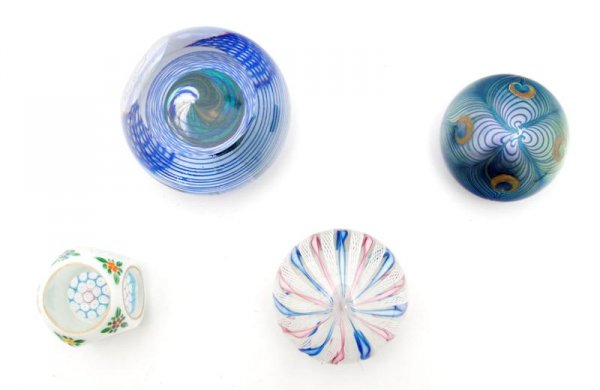 A Collection of Four Paperweights, Diameter of lar: A Collection of Four Paperweights, comprising an Orient and Flume example with others. Diameter of largest 3 1/4 inches.