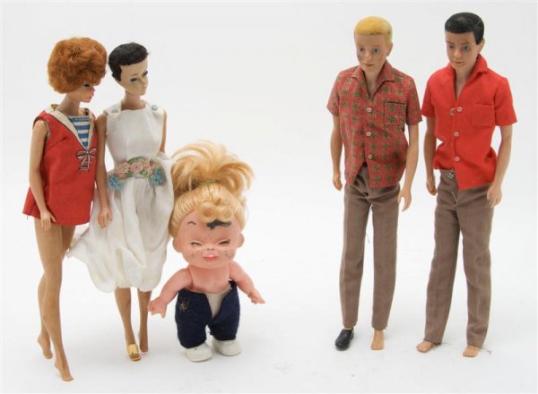 A Collection of Five Vintage Dolls, Barbie, Height: A Collection of Five Vintage Dolls, Barbie, comprising three Barbies and two Kens, together with another unrelated doll. Height of tallest 11 1/2 inches. Property from the Estate of Nancy S. Blakeslee