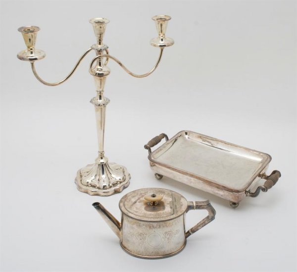A Pair of Silverplate Candelabra, Height of candel: A Pair of Silverplate Candelabra, having three lights, together with an Edwardian silverplate tea pot of oval form, having an ivory finial and insulators, chafing dish and a punch bowl. Height of cand