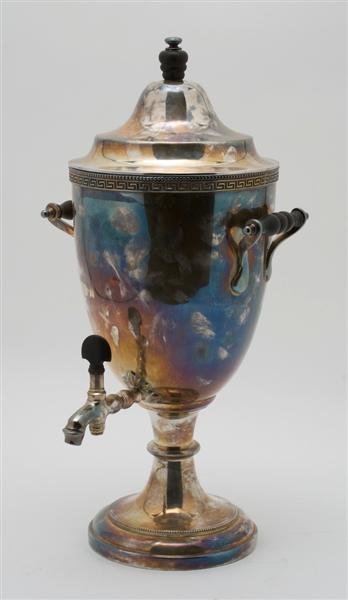 A Silverplate Tea Urn, Manhattan Plate Co., New Yo: A Silverplate Tea Urn, Manhattan Plate Co., New York, having Greek key design and ebony fittings. Width 18 inches. Property from the Estate of Leon and Marian Despres, Chicago, Illinois
