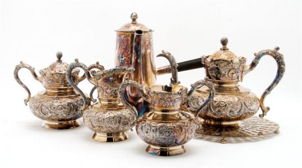 A Group of American Silverplate Articles, Height o: A Group of American Silverplate Articles, comprising and four piece partial tea set, a coffee pot and trivet; 6 items total. Height of coffee pot 10 inches.