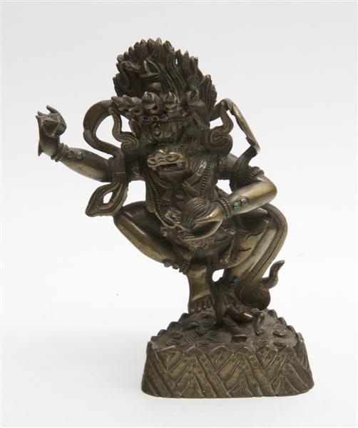 A Southeast Asian Bronze Figure of Vajrapani, Heig: A Southeast Asian Bronze Figure of Vajrapani, depicted with a flaming mandala and having inset decoration throughout, raised atop a stone form base. Height 7 1/8 inches.
