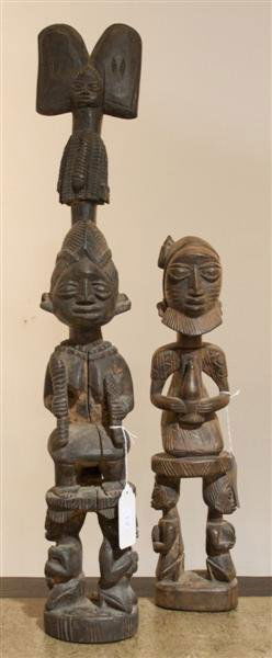 Two African Carved Wood Figures, Yoruba, Height o: Two African Carved Wood Figures, Yoruba, the first a Shango shrine figure, the female figure standing on a pedestal, wearing elaborate headdress, the second an ancestral figure standing and holding a