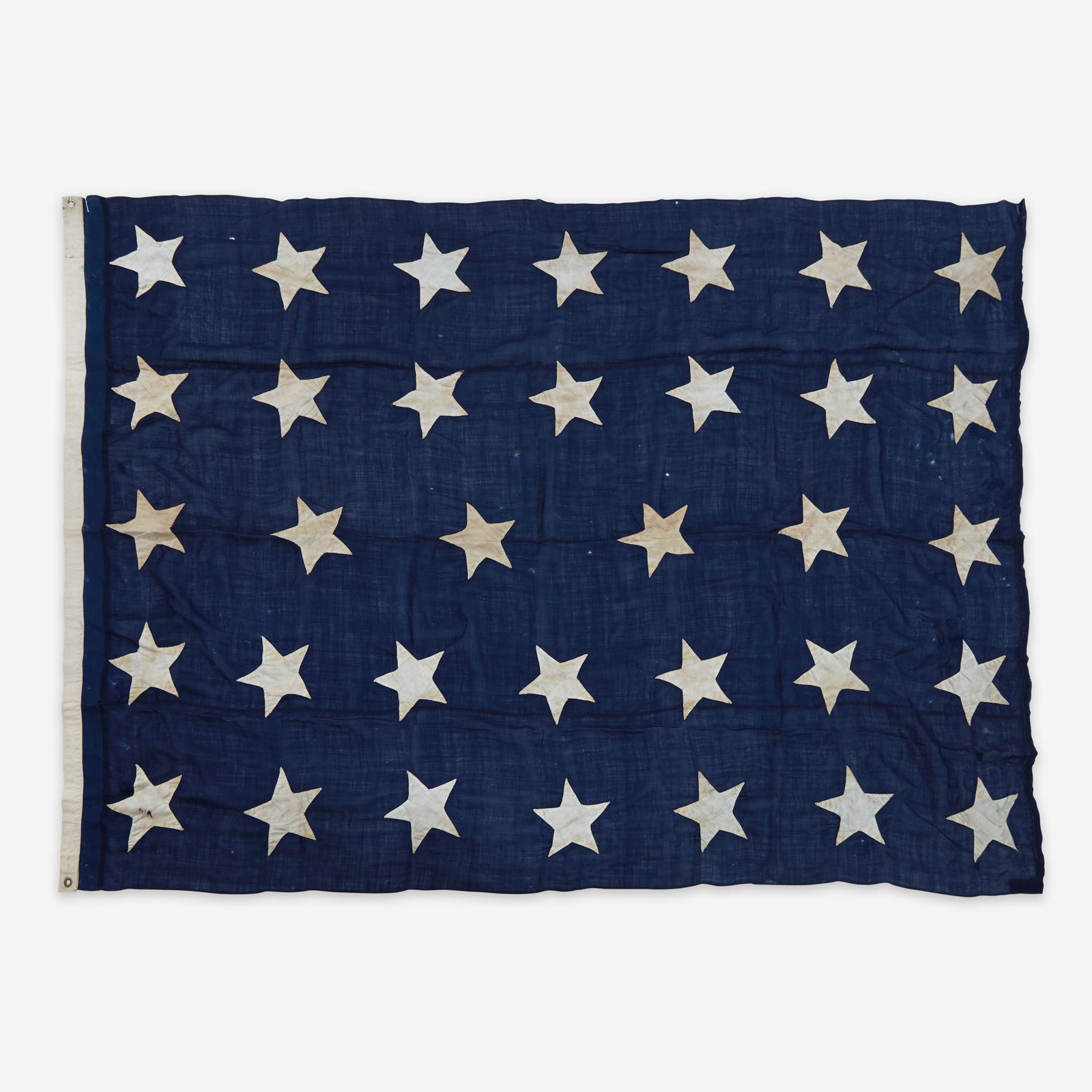 A 34-Star canton or Naval Jack commemorating Kansas: A 34-Star canton or Naval Jack commemorating Kansas statehood circa 1861 Field composed of four lengths of hand-sewn wool bunting, machine and hand-sewn cotton twill stars, canvas header with two bras