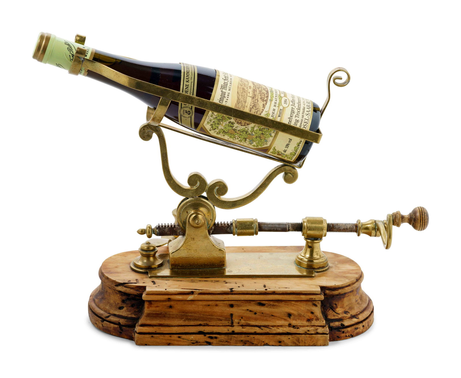 An English Brass and Walnut Port and Wine Bottle: An English Brass and Walnut Port and Wine Bottle Mechanical Decanter 19th Century Height 12 x width 13 x depth 6 inches. Property from the Collection of a Gentleman, Atlanta, Georgia