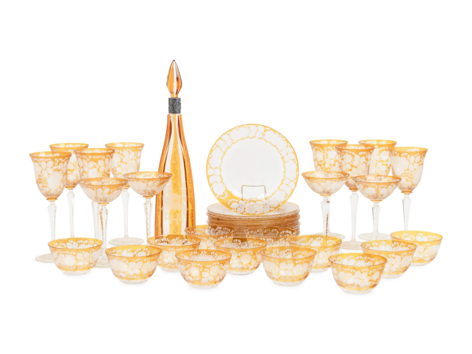 A Bohemian Amber Etched Glass Table Service : A Bohemian Amber Etched Glass Table Service Early 20th Century comprising 8 wine goblets, 4 champagne coupes, 12 bowls, 14 plates, and a decanter with a sterling silver collar; 39 items total. H