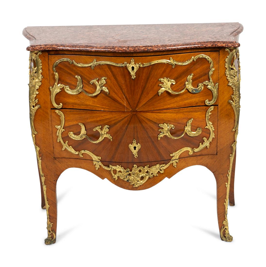 A Louis XV Style Bombe Commode with Sunburst Veneer and (1 of 2)