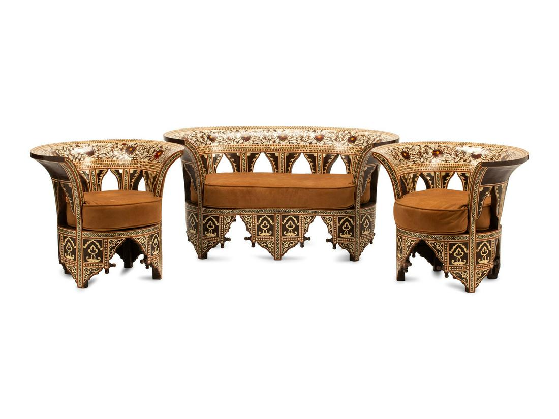 An Iberian Style Mother-of-Pearl Inlaid Seating Suite: An Iberian Style Mother-of-Pearl Inlaid Seating Suite 20th Century Height of sofa 26 x width 51 x depth 25 inches; height of chairs 26 x width 30 1/2 x depth 25 1/2 inches.