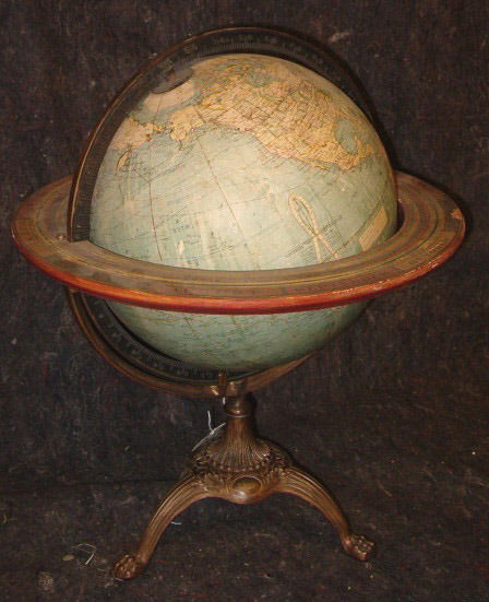 GLOBE ON STAND 20th c. The 12 in. globe made by t: GLOBE ON STAND 20th c. The 12 in. globe made by the Weber Costello Co., Chicago Heights, Illinois and supported by a mixed metal tripod base having hairy paw feet. H: 21 in. x W: 18 in.