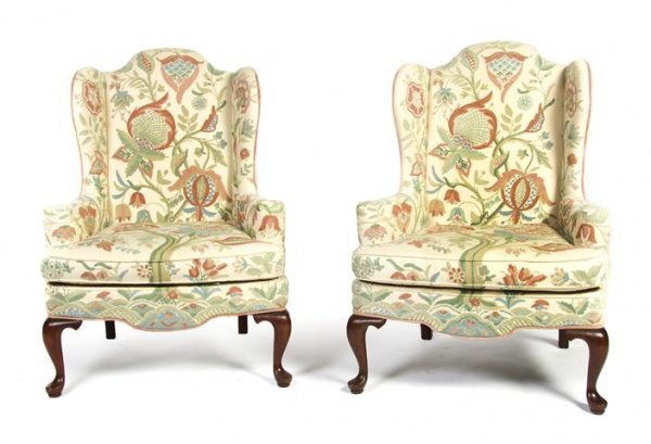 A Pair of Wingback Armchairs, Height 46 inches.: A Pair of Wingback Armchairs, having cruel upholstery with floral design, raised on squat cabriole legs at front and square splayed legs at back. Height 46 inches. Property of a Lady, Oakbrook, Illino