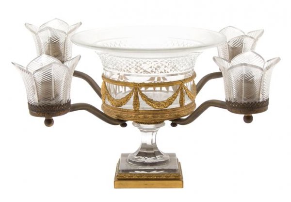 A French Cut Glass and Ormolu Mounted Center Bowl,: A French Cut Glass and Ormolu Mounted Center Bowl, Attributed to Baccarat, decorated with swags, having four candle arms. Height 7 3/4 inches.