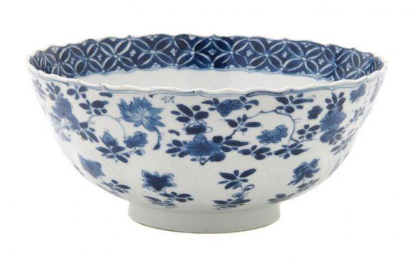 A Chinese Blue and White Porcelain Bowl, Diameter: A Chinese Blue and White Porcelain Bowl, 18th century, having molded lotus petal design with foliate sprays. Diameter 8 inches. Provenance: Ralph. M. Chait Galleries