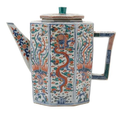 A Chinese Porcelain Teapot, Height 7 1/8 inches.: A Chinese Porcelain Teapot, of octagonal form, with dragon and phoenix decoration throughout, having underglaze blue Ming Wanli mark on underside of the spout. Height 7 1/8 inches.