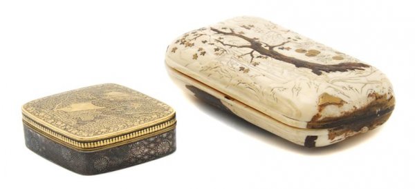 A Japanese Komai Iron Box and Lacquered Ivory Arti: A Japanese Komai Iron Box and Lacquered Ivory Article, the iron box of diamond form, with landscape scene on the top of buildings on a hillside, signed on underside, together with a lacquered and carv