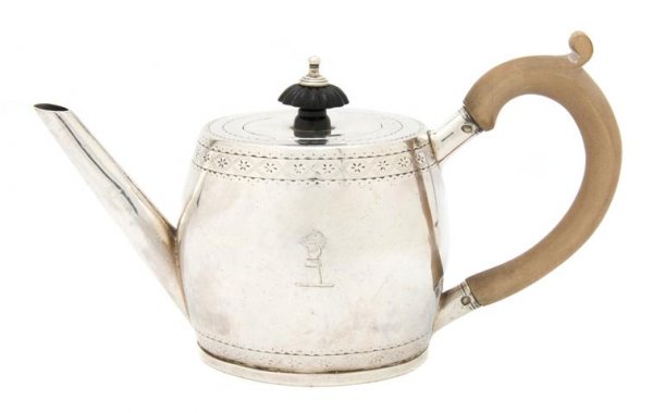 An Irish Silver Teapot, Michael Homer, Height 4 3/: An Irish Silver Teapot, Michael Homer, Dublin, circa 1785, of barrel form, with engraved decoration, having ebonized finial and wood handle; approximate weight overall 7.71 ozt. Height 4 3/8 inches.