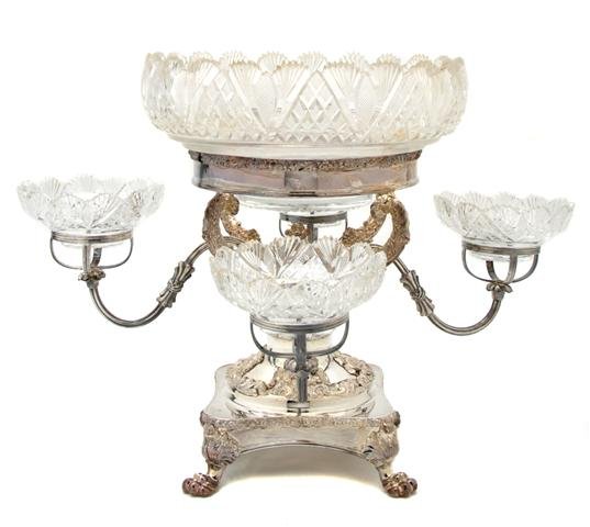 An English Silverplate and Cut Glass Epergne, Heig: An English Silverplate and Cut Glass Epergne, having a larger center bowl surrounded by four smaller bowls. Height 14 1/4 inches.