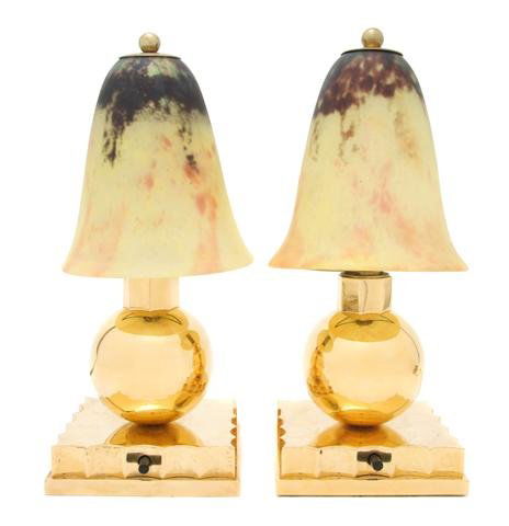 A Pair of Art Deco Lamps with Daum Glass Shades,: A Pair of Art Deco Lamps with Daum Glass Shades, the shades of vitrified glass in multiple colors, signed Daum Nancy, the brass bases having fluted design. Height of shades 5 1/4 inches.