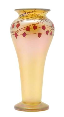 An Orient & Flume Iridescent Glass Vase, Height 1: An Orient & Flume Iridescent Glass Vase, having decoration in the top register of hanging heart forms in red glass, signed by Scott Beyers. Height 10 1/4 inches.