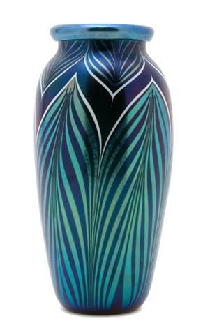 An Orient & Flume Iridescent Glass Vase, Height 1: An Orient & Flume Iridescent Glass Vase, of pulled silver glass over a cobalt ground, signed 1983 Orient & Flume D 50. Height 10 1/2 inches.