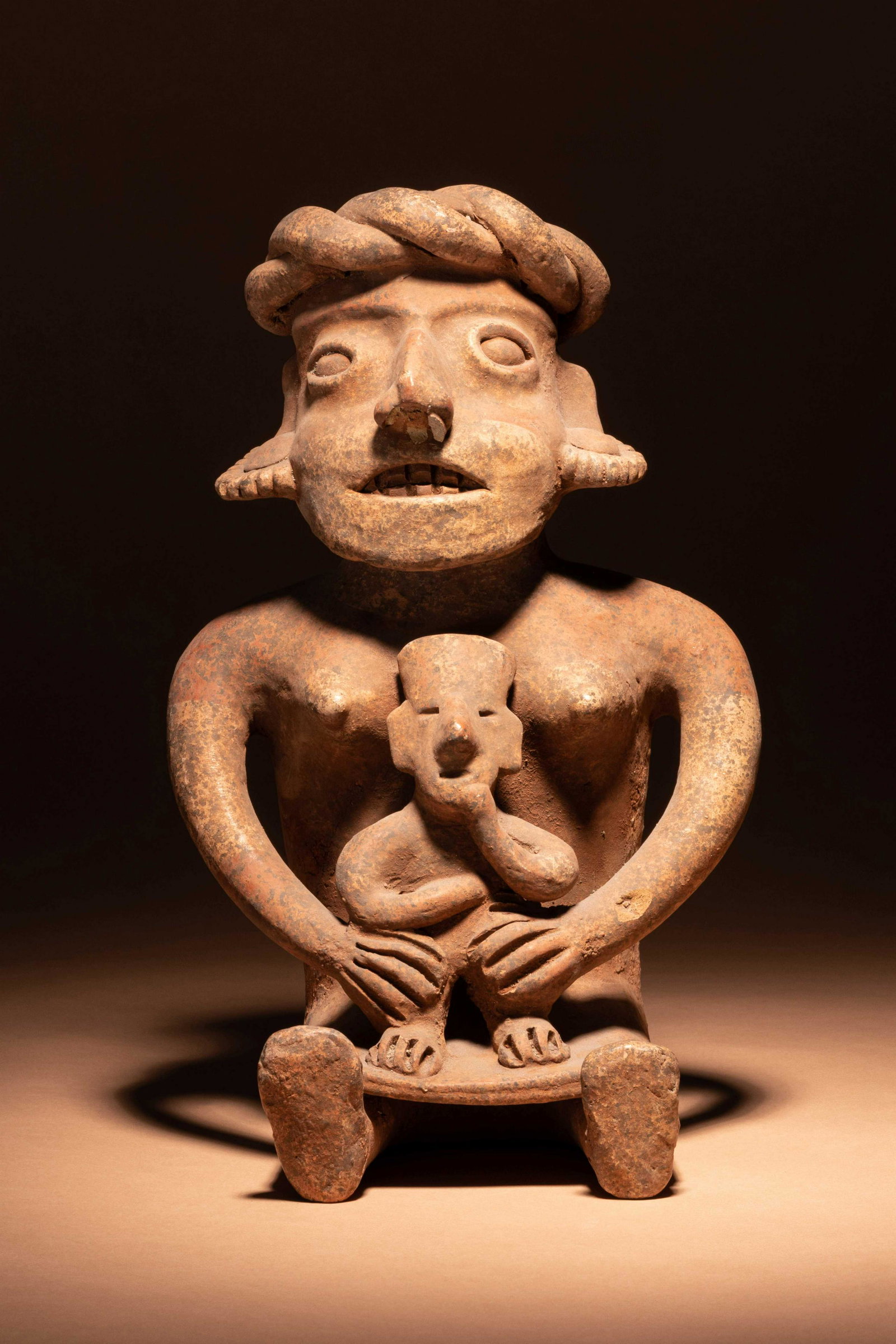 A Colima Terracotta Seated Mother and Child Figure (1 of 3)