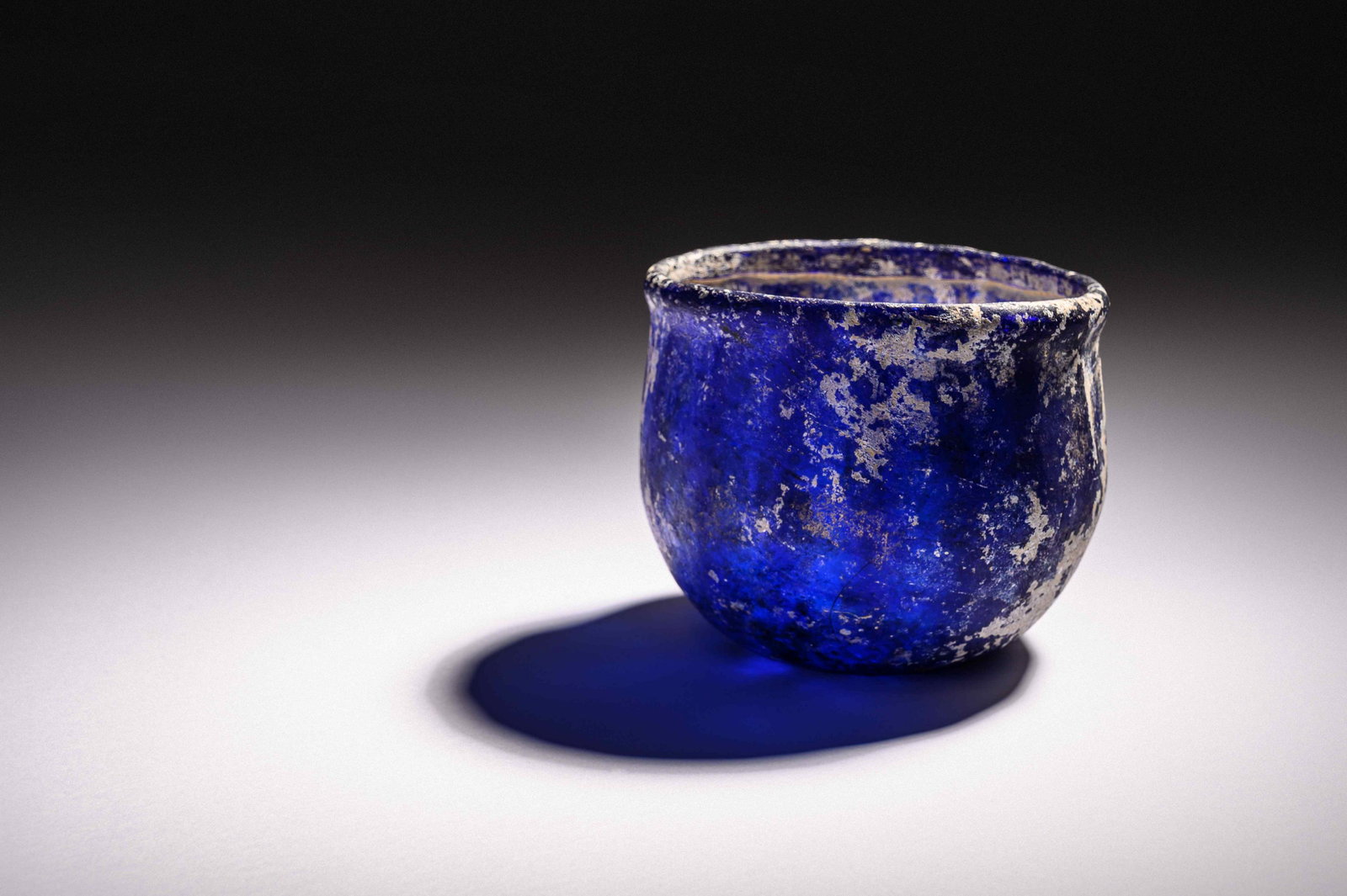 A Roman Blue Glass Ribbed Bowl Height 3 1/4 x diameter (1 of 3)