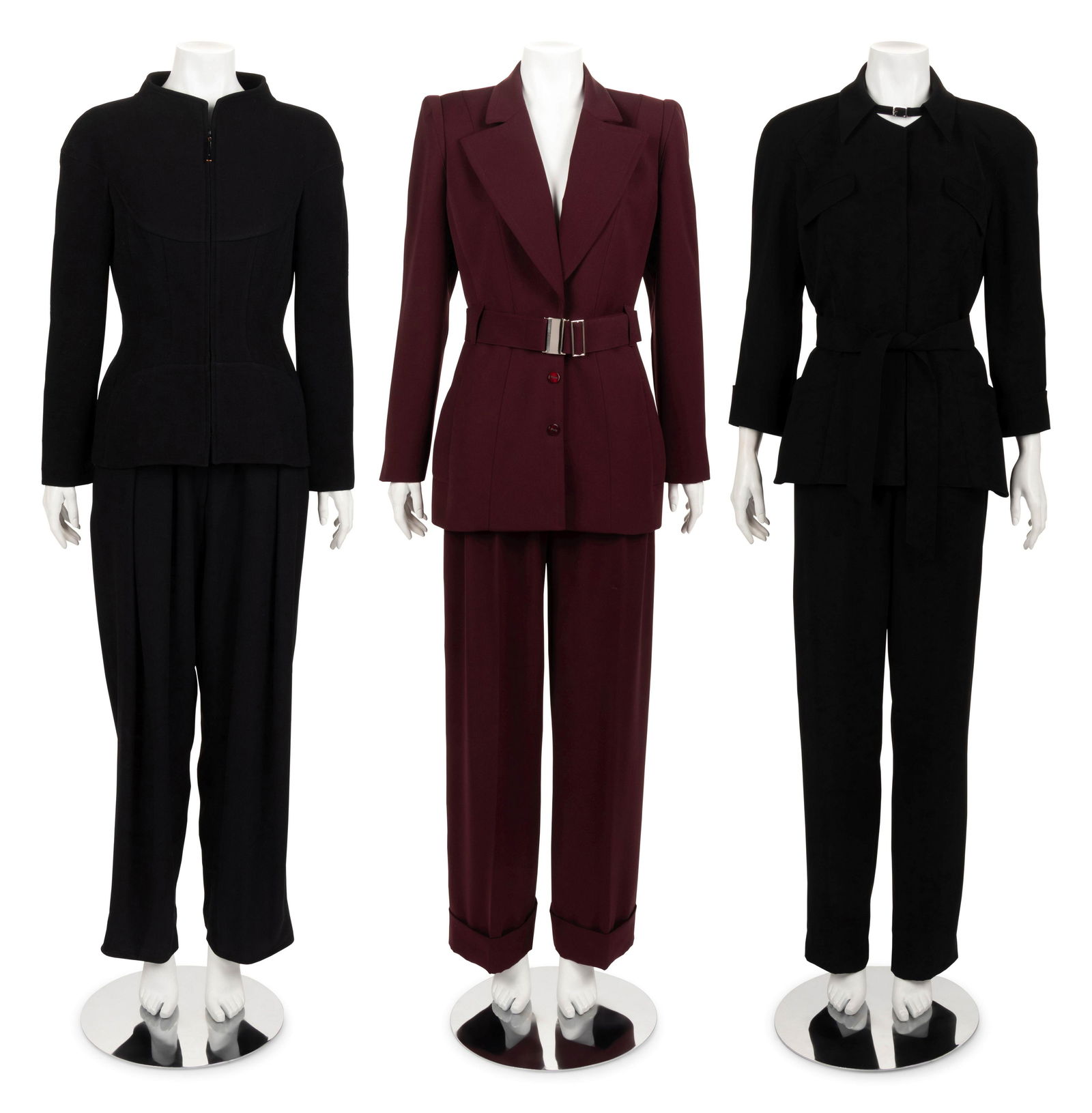 Three Thierry Mugler Two-Piece Suits, 1985-95: Three Thierry Mugler Two-Piece Suits, 1985-95 This lot includes three two-piece suits. THE FIRST Burgundy polyester two-piece pant suit including a wide peak lapel jacket with inseam hip pockets, belt