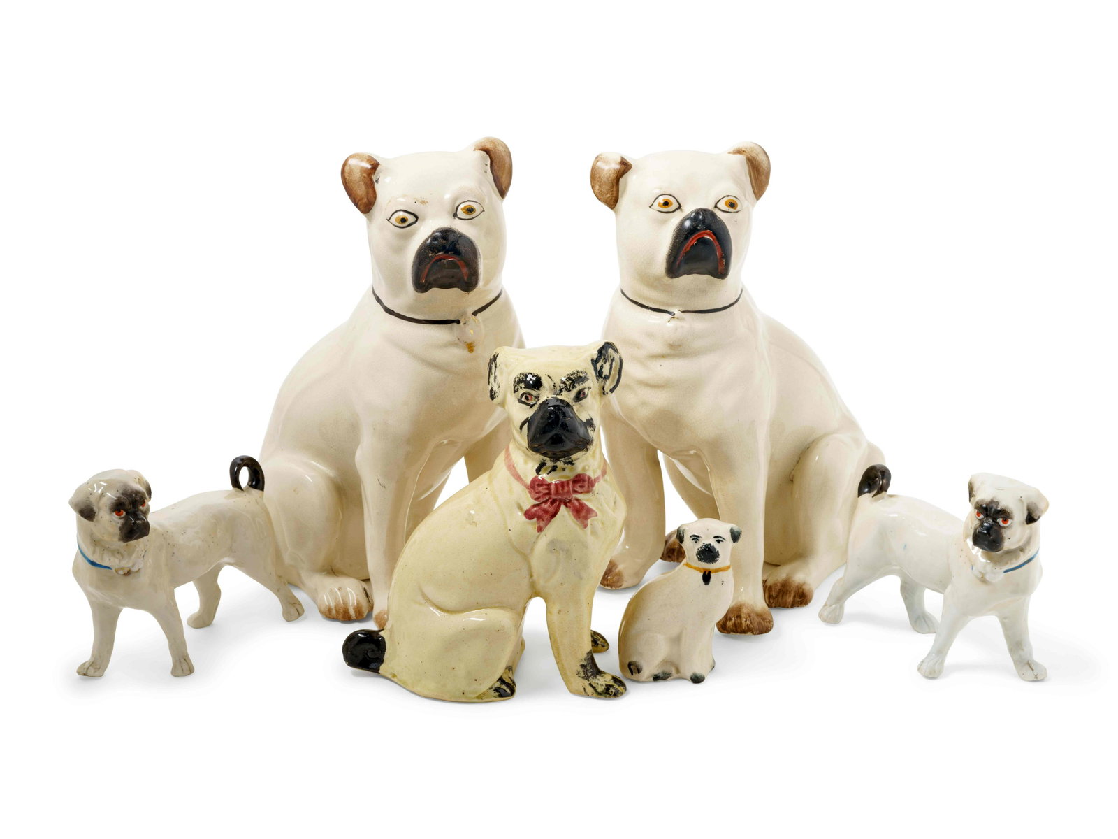 A Group of Glazed Ceramic Pug Figures: A Group of Glazed Ceramic Pug Figures 6 items total. Height of tallest pair 10 1/2 inches. Property from The Estate of Heather Graham Glickman, Chicago, Illinois